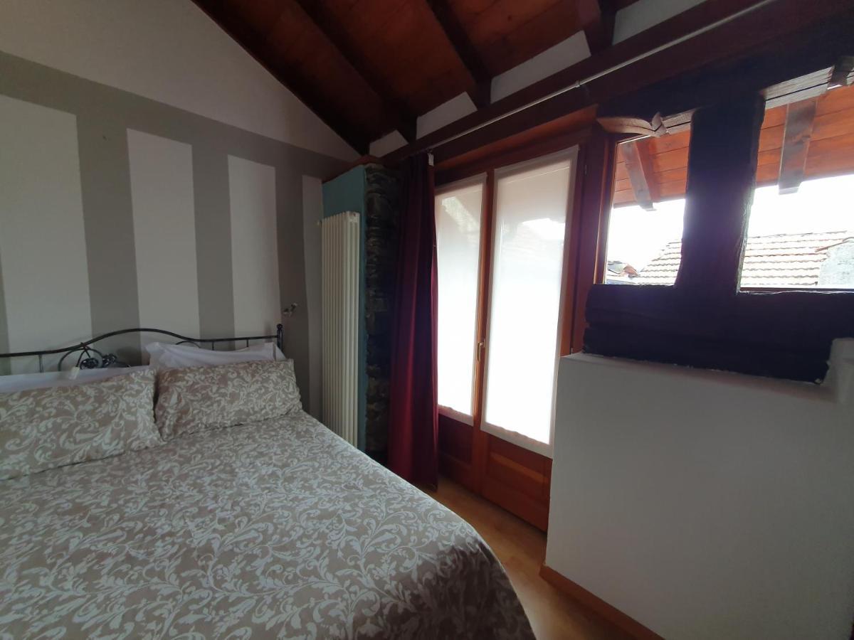 Appartamenti Vacanze E Camere Roccetta Fiorita Pettenasco Bagian luar foto